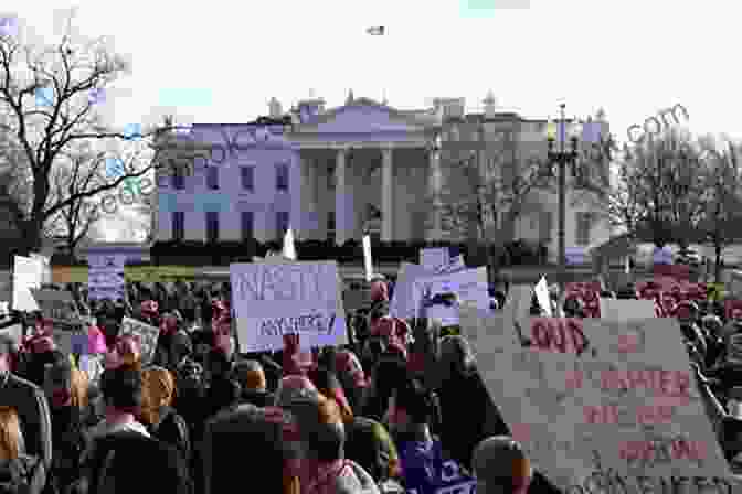 A Group Of People Protesting Outside The White House Holding Signs That Say Wingnuts: Extremism In The Age Of Obama